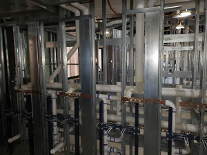 Domestic water piping insulated with fiberglass pipe cover