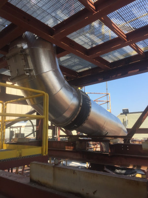 Thirty-four-inch burner exhaust duct insulated with 3" mineral wool finished with aluminum jacketing. Franklin insulation gallery