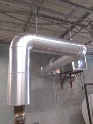 Close front view of generator muffler. Franklin insulation gallery