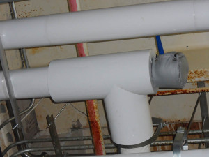 Chocolate piping at bakery insulated with 2" fiberglass, white PVC jacket and finished with a custom pad on the end to allow for future maintenance. Franklin insulation gallery